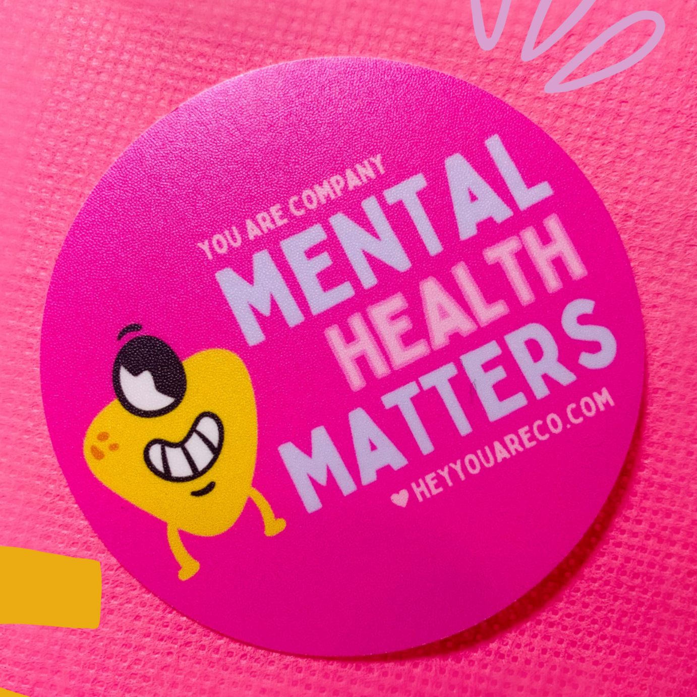 This sticker says "Mental Health Matters"; Colors: Pink, Blue, Yellow; Elements: small blob guy